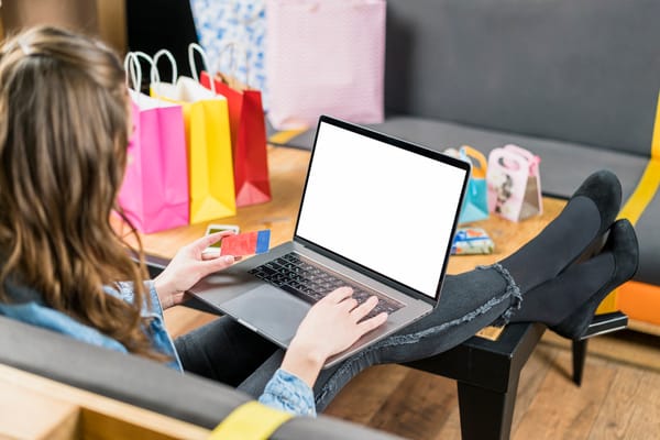 young woman using credit card pa